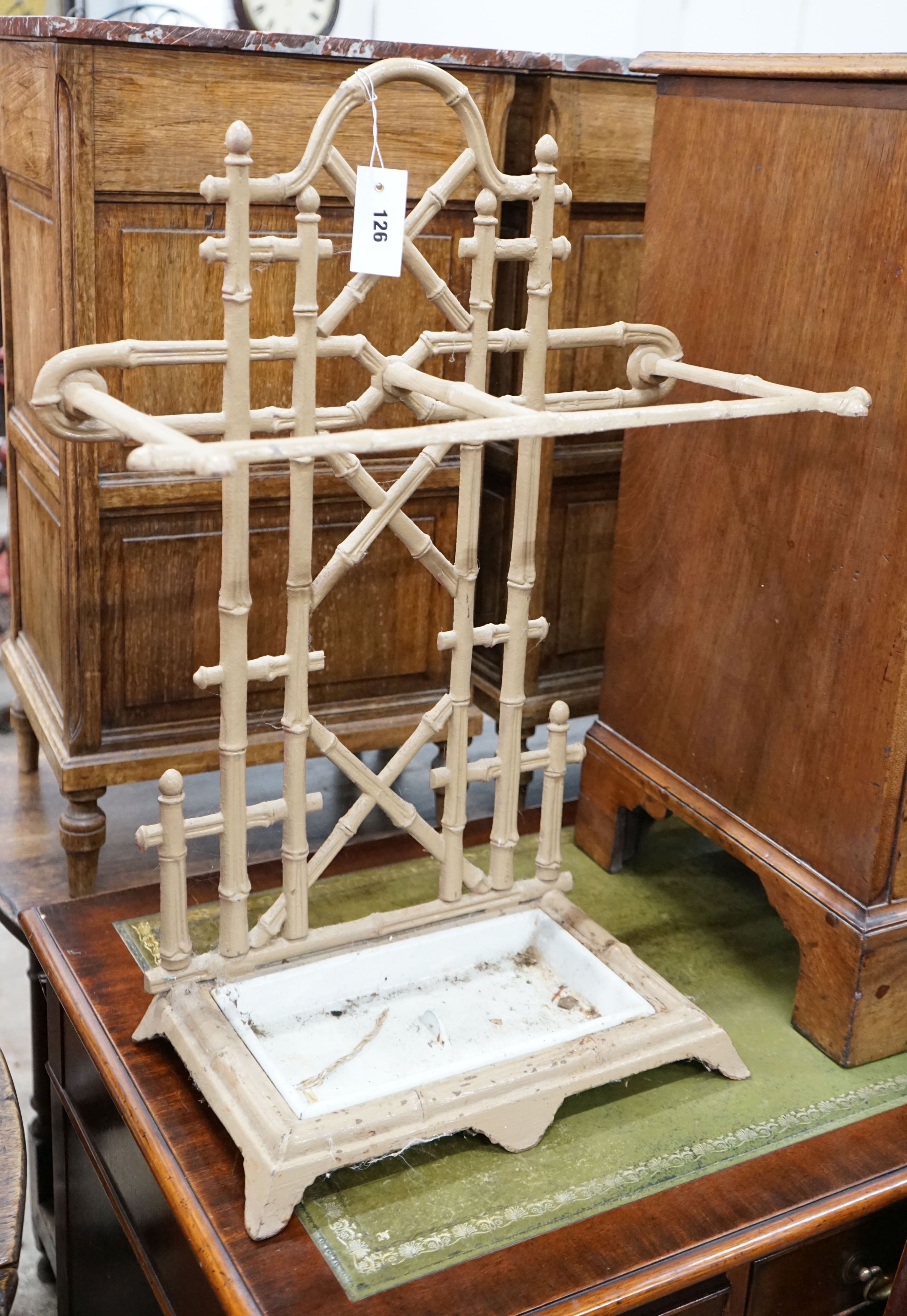 A Victorian style painted metal faux bamboo stick stand, width 52cm, height 70cm